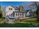 View of the home's exterior featuring an outdoor patio area, a manicured lawn, and mature trees at 107 Doris Ct, Lincolnton, NC 28092