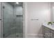 Clean bathroom offers tiled glass shower with bench, gray vanity, and modern fixtures at 107 Doris Ct, Lincolnton, NC 28092