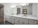 Bright bathroom features double sinks, large mirror, and spacious vanity for plenty of storage at 107 Doris Ct, Lincolnton, NC 28092
