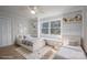 Stylishly decorated bedroom includes a window seat, built-in shelves, and twin beds at 107 Doris Ct, Lincolnton, NC 28092