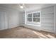 Bright bedroom includes a window seat with shelving and a wide window for optimal sunlight at 107 Doris Ct, Lincolnton, NC 28092