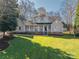 Charming two-story home featuring a welcoming front porch and a well-manicured lawn on a sunny day at 107 Doris Ct, Lincolnton, NC 28092