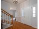 Bright and spacious foyer featuring hardwood floors, white trim, and a view into the living room at 107 Doris Ct, Lincolnton, NC 28092