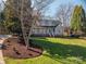 Beautiful two-story home with a welcoming front porch, well-manicured lawn and lush landscaping at 107 Doris Ct, Lincolnton, NC 28092