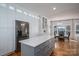 Bright kitchen featuring a center island, stainless steel appliances, and an adjacent breakfast nook at 107 Doris Ct, Lincolnton, NC 28092