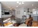 Spacious living room boasts hardwood floors, a ceiling fan, and a built-in entertainment center with shelving at 107 Doris Ct, Lincolnton, NC 28092