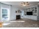 Bright living room boasts carpeted floors, a fireplace, and built-in shelving for ample storage at 107 Doris Ct, Lincolnton, NC 28092