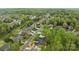 An attractive neighborhood shows a well-kept suburban community, lush green trees, and mature landscaping at 109 Stirling Heights Ln, Fort Mill, SC 29715