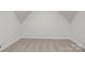 A bedroom with a neutral carpet, light gray walls, and electrical outlets at 109 Stirling Heights Ln, Fort Mill, SC 29715