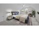 Bright bedroom with vaulted ceiling, large window, and stylish decor at 109 Stirling Heights Ln, Fort Mill, SC 29715
