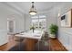 Formal dining room with a marble table, stylish chairs, and elegant chandelier at 109 Stirling Heights Ln, Fort Mill, SC 29715