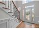 Bright and spacious foyer with hardwood floors and a decorative front door with sidelights at 109 Stirling Heights Ln, Fort Mill, SC 29715
