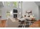 Bright and airy living room with a fireplace, high ceilings, and large windows at 109 Stirling Heights Ln, Fort Mill, SC 29715