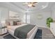Serene main bedroom with a king-size bed, soft lighting, and stylish decor at 109 Stirling Heights Ln, Fort Mill, SC 29715