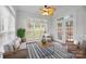 Cozy sunroom with comfortable seating and abundant natural light at 109 Stirling Heights Ln, Fort Mill, SC 29715