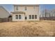 Exterior view of the home featuring a spacious backyard with a wooden fence at 1178 Valley St, Statesville, NC 28677