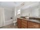 Bathroom featuring double vanity with granite countertops, a shower-tub combo, and neutral-colored tiles at 1178 Valley St, Statesville, NC 28677