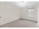 Bedroom featuring carpet flooring, a single window offering natural light, and neutral-colored walls at 1178 Valley St, Statesville, NC 28677