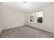 Bright bedroom with two large windows offering great natural light, neutral walls, and carpet floors at 1178 Valley St, Statesville, NC 28677
