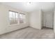 Bright bedroom featuring carpeted floors and two windows offering ample natural light at 1178 Valley St, Statesville, NC 28677