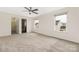 Bright bedroom with large windows, ceiling fan, neutral walls, carpet floors, and an ensuite bathroom for added convenience at 1178 Valley St, Statesville, NC 28677