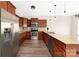 Contemporary kitchen with stainless steel appliances, granite counters, and rich wood cabinets at 1178 Valley St, Statesville, NC 28677