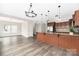Open-concept kitchen showcasing a large island with granite countertops and modern pendant lighting at 1178 Valley St, Statesville, NC 28677