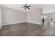 Spacious living room showcasing modern gray wood-look floors that transition to a kitchen area at 1178 Valley St, Statesville, NC 28677