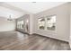 Bright living room with modern chandelier and expansive windows offering outdoor views and natural light at 1178 Valley St, Statesville, NC 28677