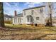 View of the backyard and exterior of the home, featuring lots of windows for natural light at 11834 Mallard Ridge Dr, Charlotte, NC 28269