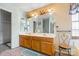 Bathroom featuring double vanity sinks with ample counter space and great lighting at 11834 Mallard Ridge Dr, Charlotte, NC 28269
