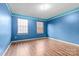 Light-filled bedroom with wood-look flooring, and a double window at 11834 Mallard Ridge Dr, Charlotte, NC 28269
