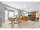 Open kitchen and dining area, flowing into the living room with a fireplace at 11834 Mallard Ridge Dr, Charlotte, NC 28269