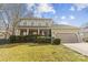 Charming two-story home with a well-manicured lawn and a covered front porch, inviting you to relax and enjoy the outdoors at 11834 Mallard Ridge Dr, Charlotte, NC 28269