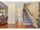 Inviting foyer with hardwood floors and staircase leading to the upper level at 11834 Mallard Ridge Dr, Charlotte, NC 28269