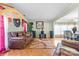 The living room features hardwood floors, comfortable seating and an adjacent dining area at 11834 Mallard Ridge Dr, Charlotte, NC 28269