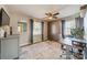 Versatile bedroom with a Murphy bed, ceiling fan, and ample natural light perfect for a home office at 1310 Seneca Pl, Charlotte, NC 28209