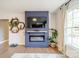 Stylish fireplace with TV and modern decor accents create a focal point in this cozy living space at 1310 Seneca Pl, Charlotte, NC 28209