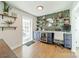 Stylish home office with custom cabinets, beverage cooler, floating shelves, and modern decor at 1310 Seneca Pl, Charlotte, NC 28209