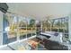 Relaxing screened porch with comfortable seating and wooded view at 1310 Seneca Pl, Charlotte, NC 28209
