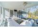 Relaxing screened porch with comfortable seating and ceiling fan at 1310 Seneca Pl, Charlotte, NC 28209