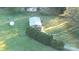 Aerial view showcasing the house with a spacious lawn and bordered by mature trees and shrubs at 137 Beaverbrook Rd, Statesville, NC 28677