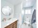 Clean bathroom with tiled countertop, a glass shower, and neutral color palette at 137 Beaverbrook Rd, Statesville, NC 28677