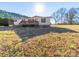 Home exterior featuring a wooden deck and a well-maintained lawn area at 137 Beaverbrook Rd, Statesville, NC 28677