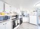 Efficient kitchen featuring white cabinets, updated appliances, and ample counter space at 137 Beaverbrook Rd, Statesville, NC 28677