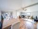 Open concept area featuring dining table and an adjacent living room with a fireplace at 137 Beaverbrook Rd, Statesville, NC 28677