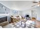 Comfortable living room with a fireplace, plush seating, and a checkered rug at 137 Beaverbrook Rd, Statesville, NC 28677