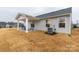 Cozy covered patio area with stylish outdoor furniture, ideal for enjoying the backyard at 143 Commerce Blvd, Lancaster, SC 29720