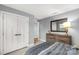 Well-lit bedroom featuring a dresser, ample closet space, and a serene atmosphere for relaxation and comfort at 143 Commerce Blvd, Lancaster, SC 29720