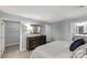 Stylish bedroom with a soft bed, a wooden dresser with mirror, and doors to closet and bathroom at 143 Commerce Blvd, Lancaster, SC 29720